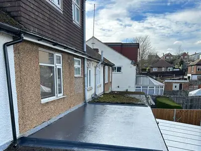 A flat extension roof in Orpington finished in grey GRP fibreglass